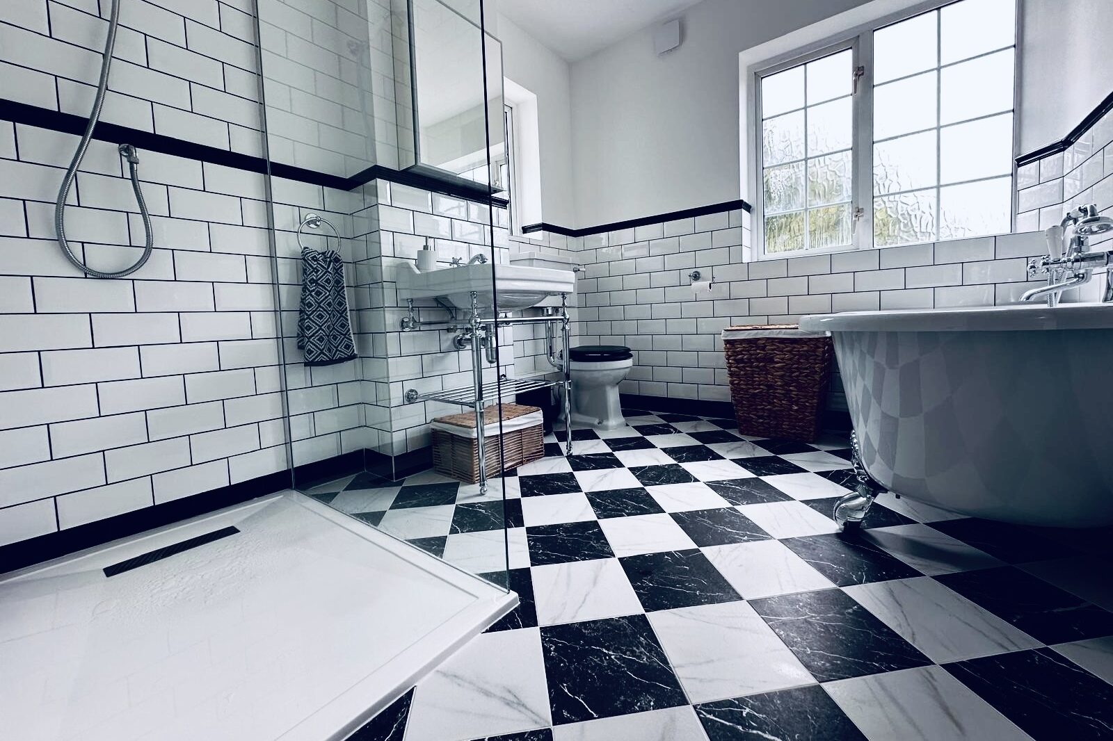 Checkerboard tile flooring detail in Victorian bathroom renovation, New Eltham.