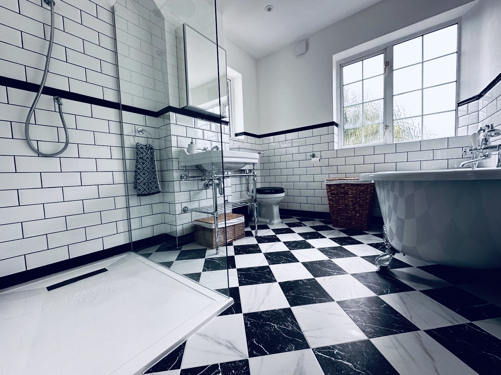 Checkerboard tile flooring detail in Victorian bathroom renovation, New Eltham.